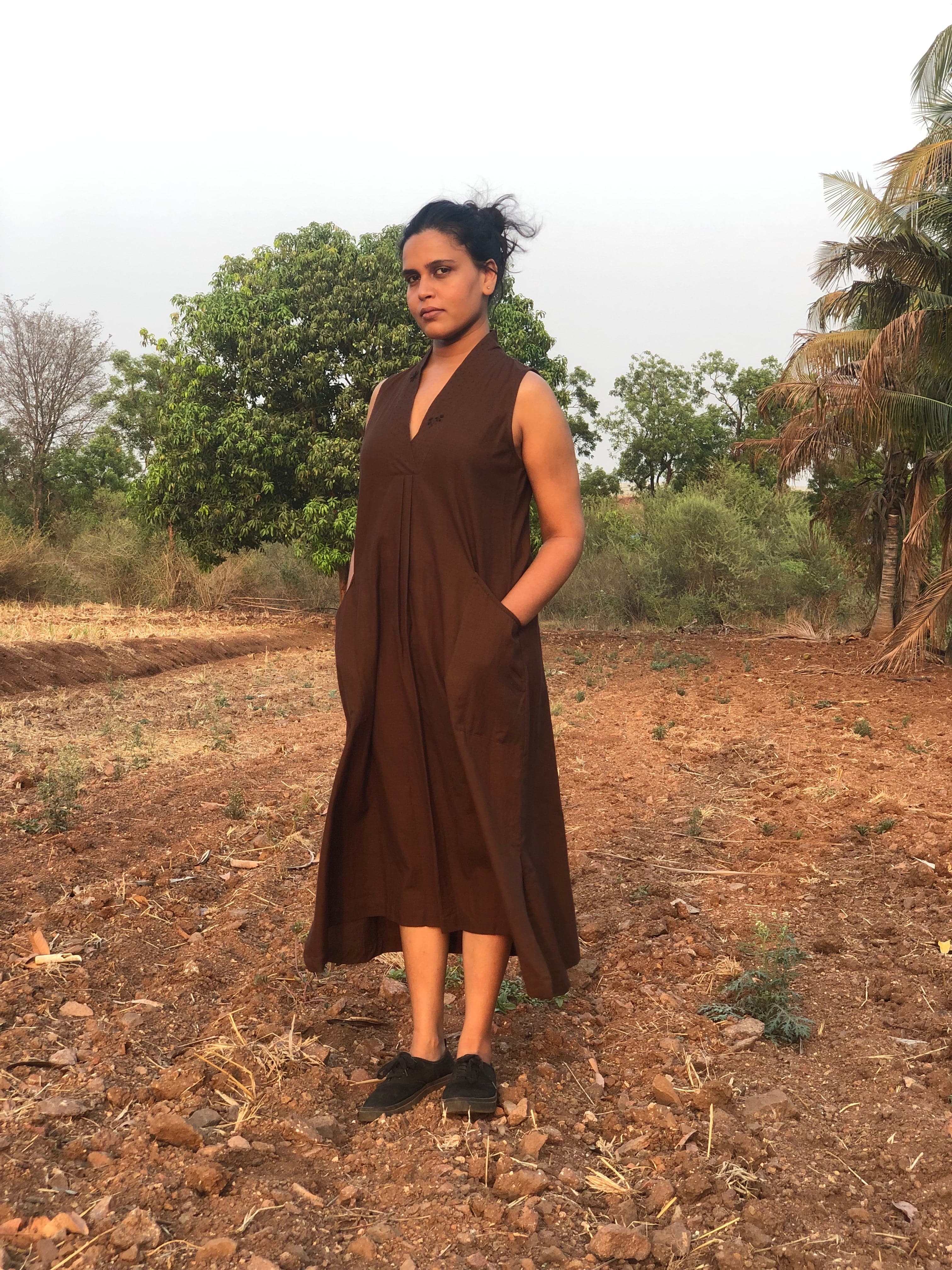 Deeta Coco dress displayed on a model, featuring a flowy design with floral patterns and lightweight fabric.