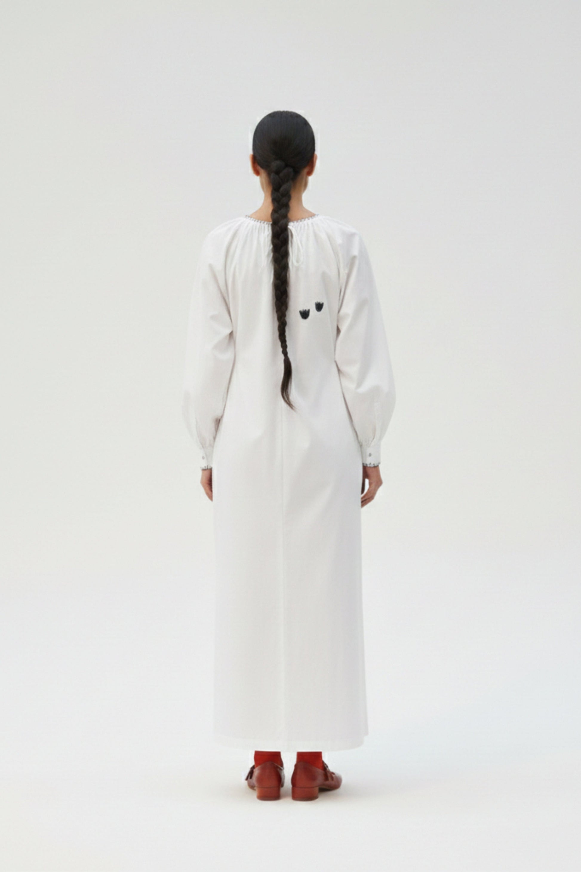 White Astrid dress by Doodlage featuring a flowy silhouette and elegant design, perfect for casual or semi-formal occasions.