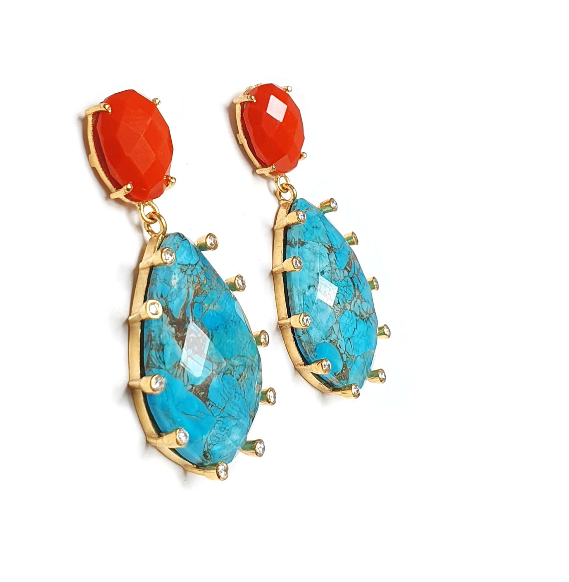 Turquoise earrings from Bombaybirds, featuring vibrant blue stones and intricate silver settings.