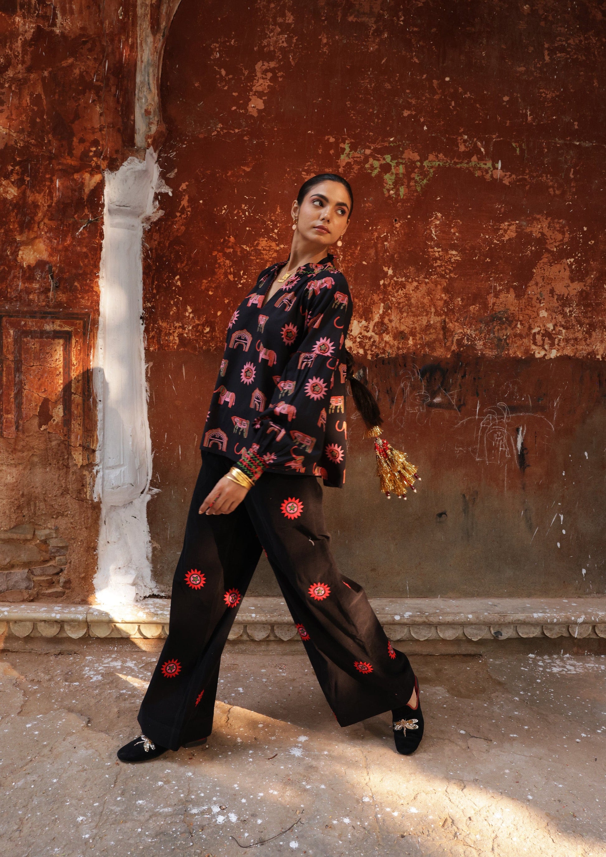The Raw India Amer pants with sun embroidery, casual bottoms featuring intricate sun design, made from comfortable fabric.