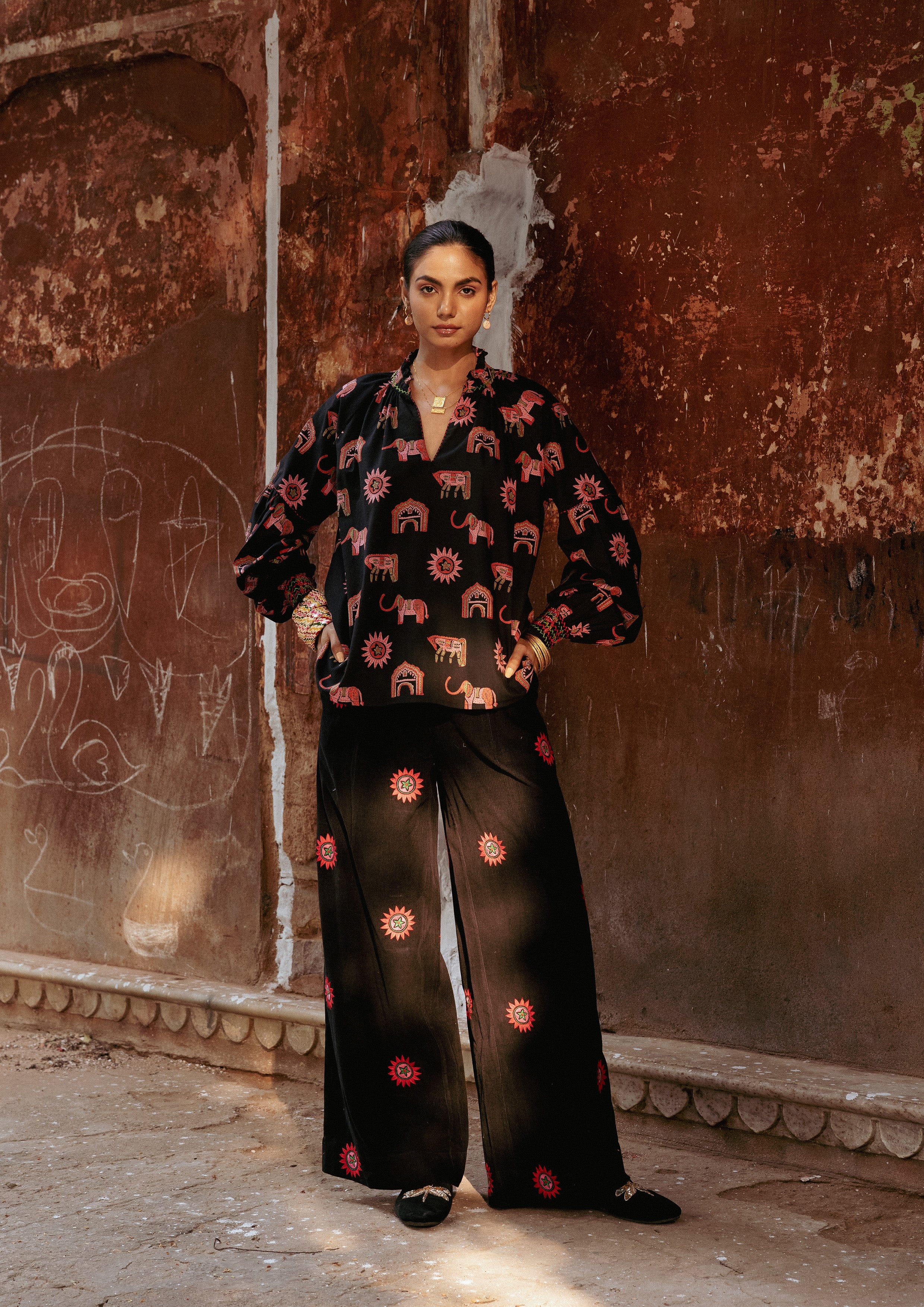 The Raw India Amer pants with sun embroidery, stylish bottoms featuring intricate sun design on comfortable fabric.