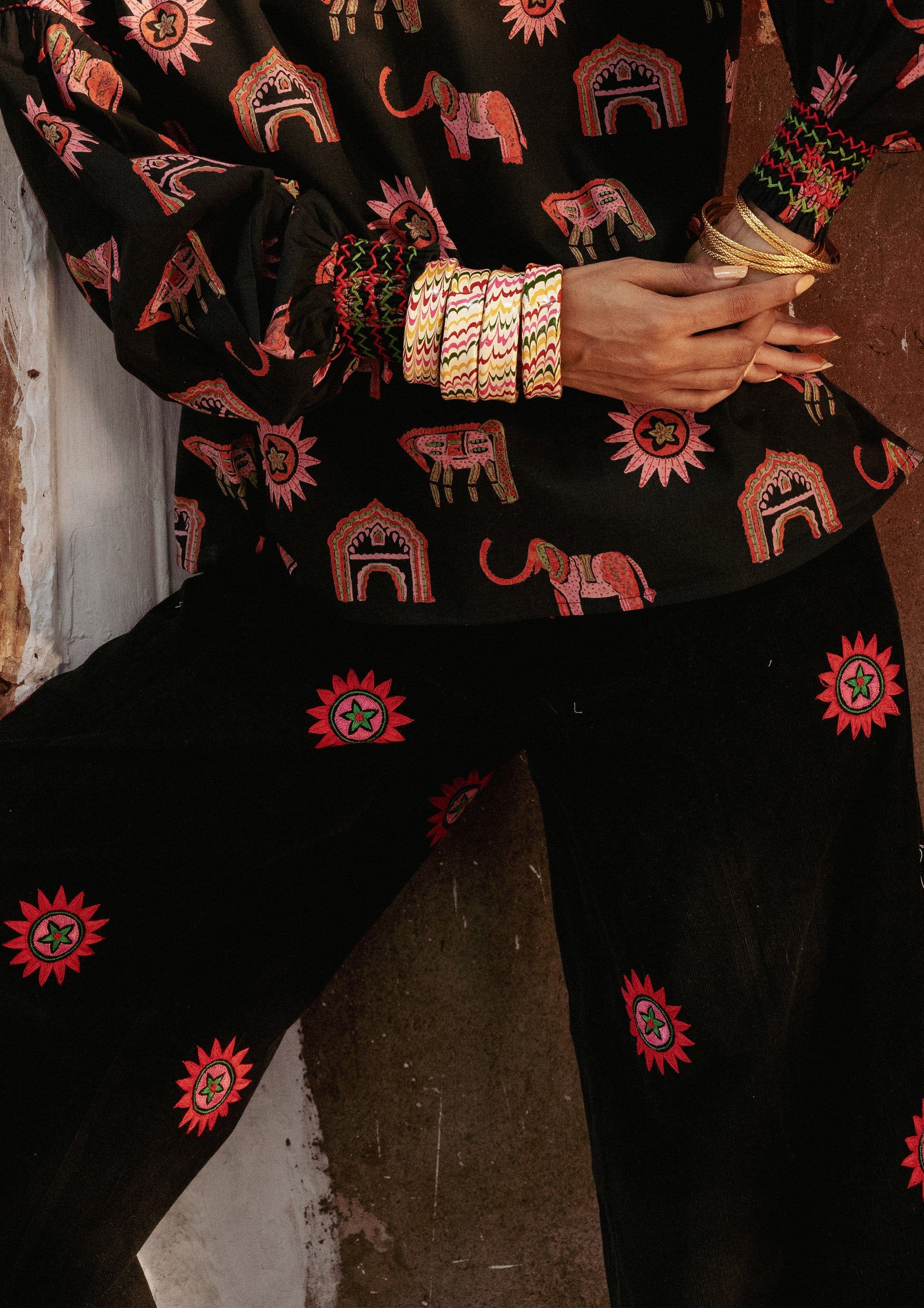 The Raw India Amer pants with sun embroidery, stylish bottoms featuring intricate sun designs on lightweight fabric.
