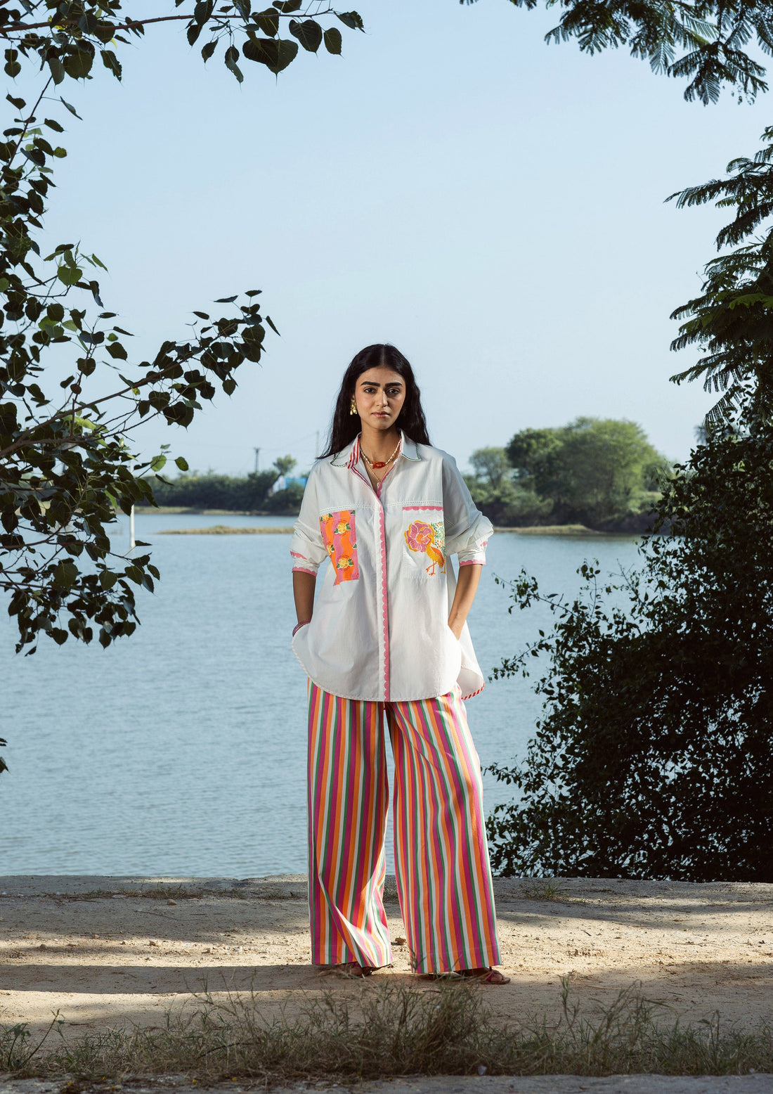 Multi-color striped Amer pants by The Raw India, casual bottoms featuring vibrant horizontal stripe patterns.