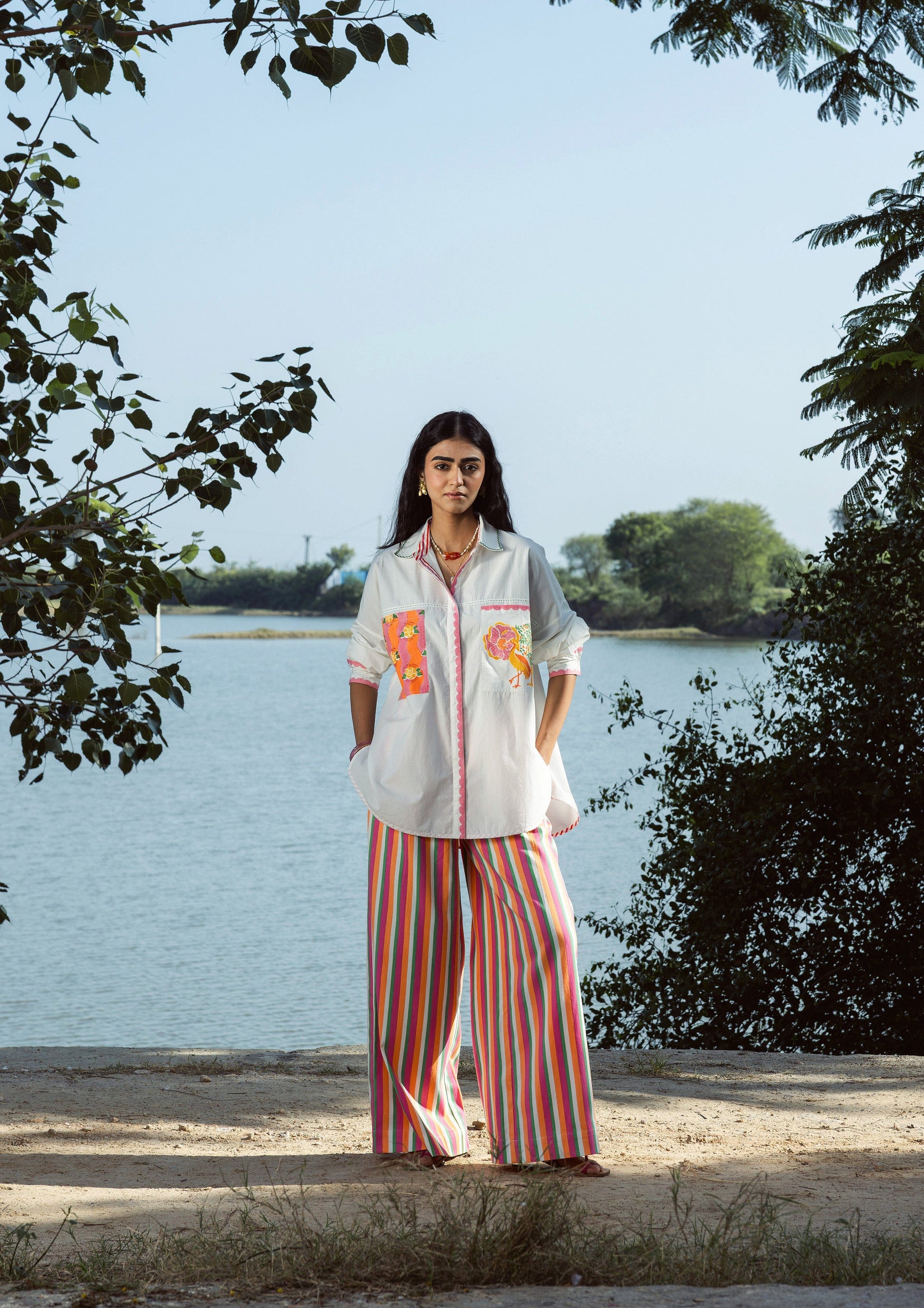 Multi-color striped Amer pants by The Raw India, casual bottoms featuring vibrant horizontal stripe patterns.