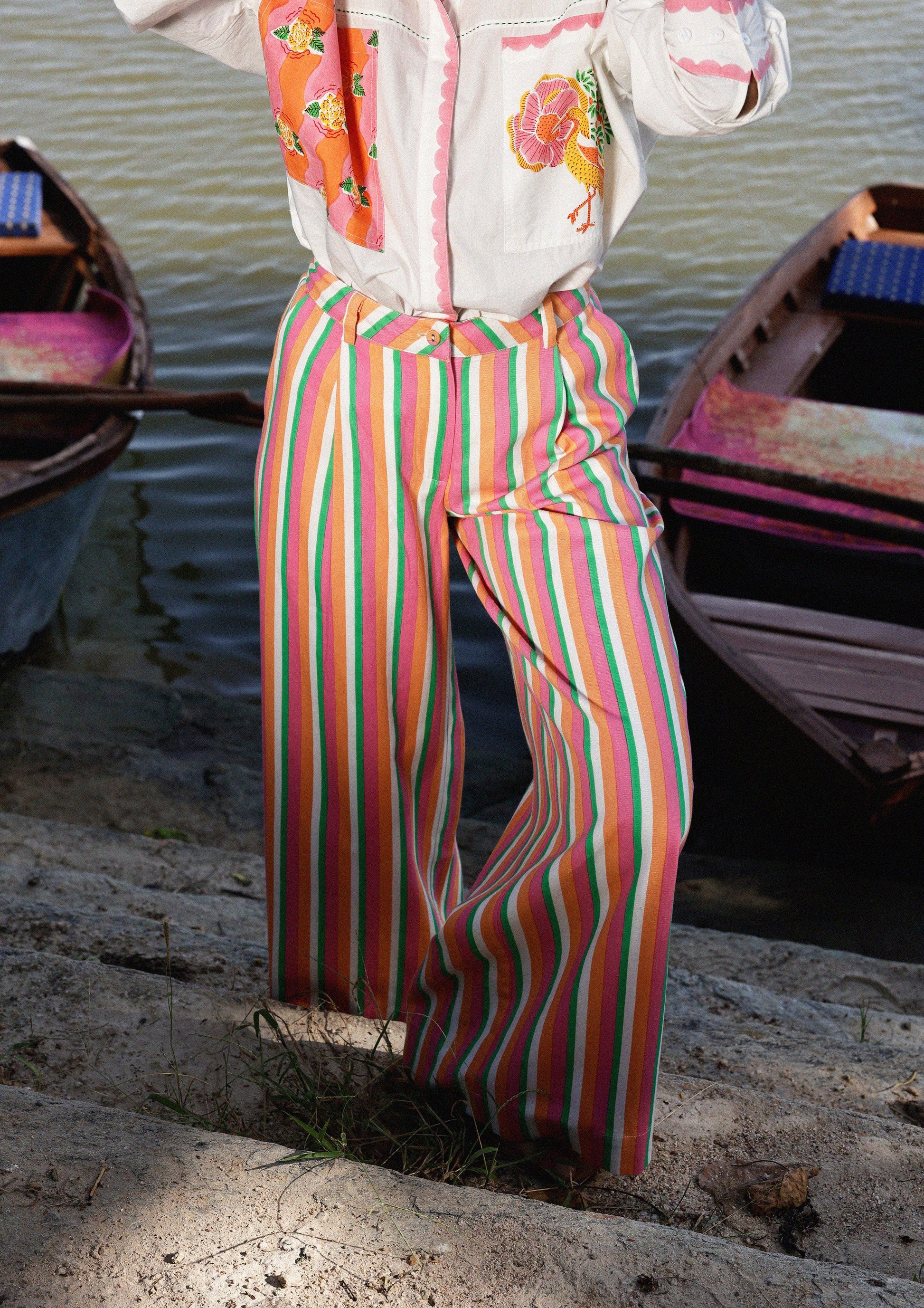 Multi-color striped Amer pants by The Raw India, showing the vibrant design and casual fit of these stylish bottoms.