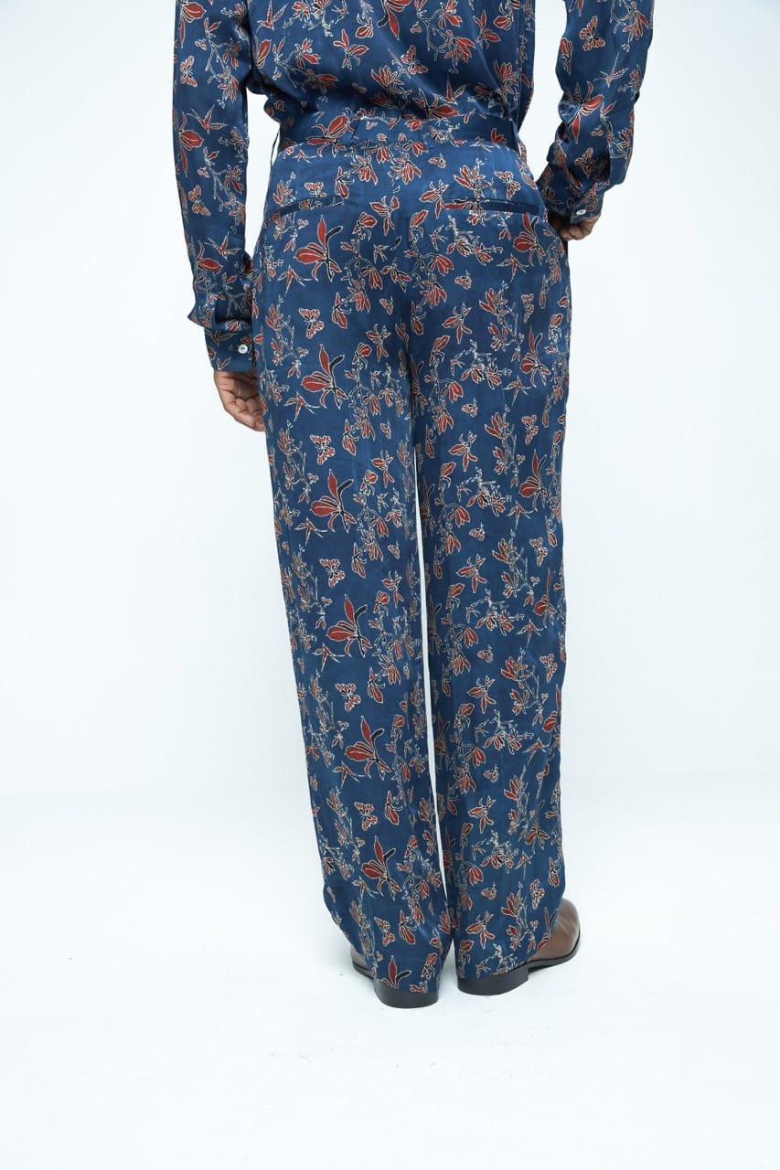 Anushe Pirani garden pleat pants in a relaxed fit, showing the back view with pleated details and comfortable fabric.