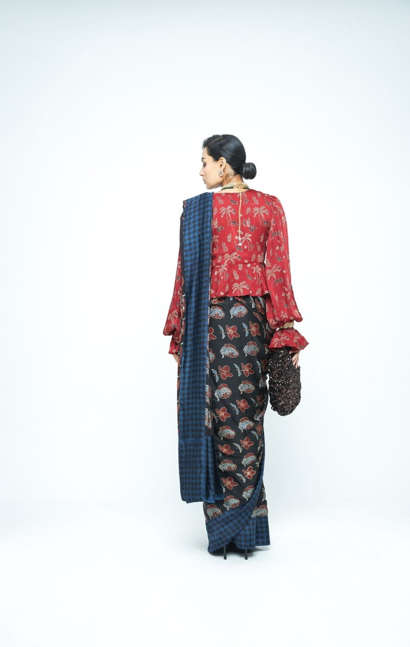 Anushe Pirani Wild Bloom saree with intricate floral patterns and vibrant colors, displayed on a mannequin.