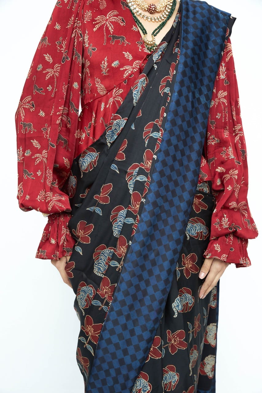 Elegant wild bloom saree by Anushe Pirani featuring vibrant floral patterns and intricate detailing in soft fabric.
