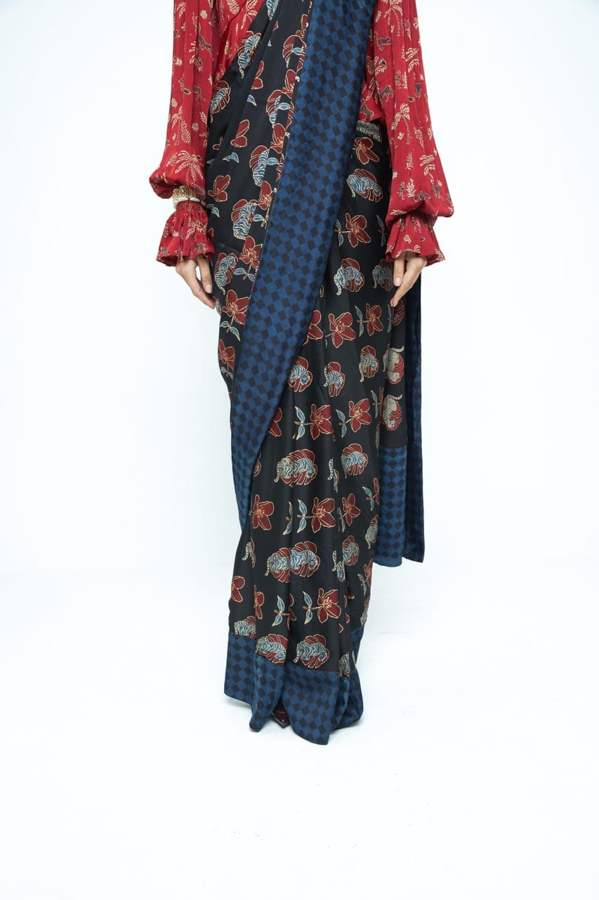 Pre-stitched Wild Bloom saree by Anushe Pirani featuring vibrant floral patterns and intricate detailing.
