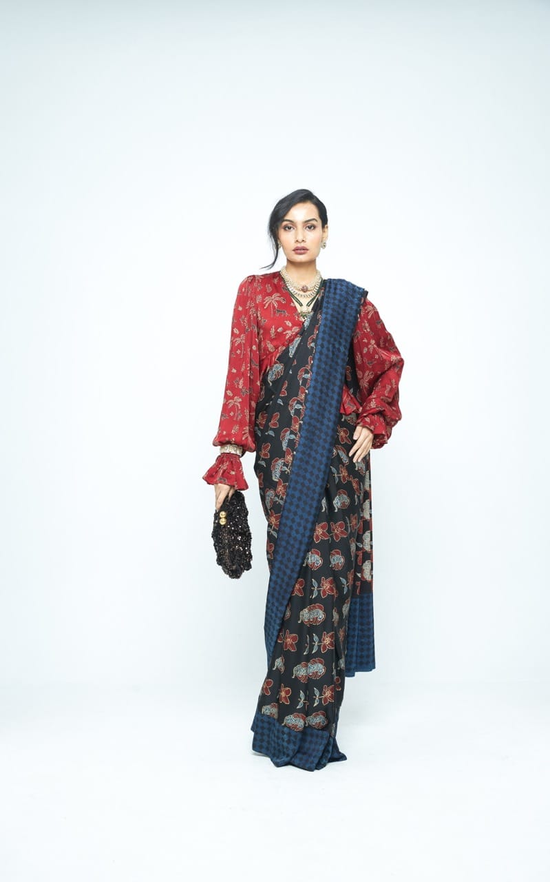 Elegant Wild Bloom saree by Anushe Pirani featuring vibrant floral patterns and intricate designs in rich fabric.