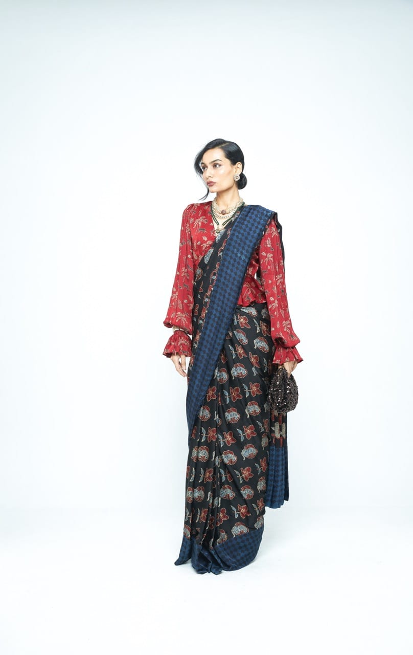 Elegant Wild Bloom saree by Anushe Pirani featuring vibrant floral patterns and traditional drape style.