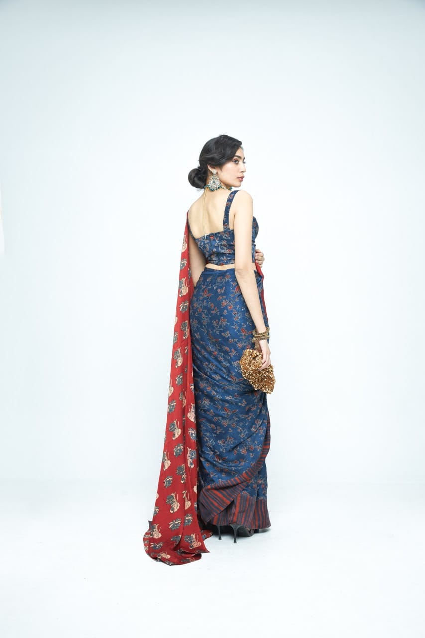 Elegant Eden saree by Anushe Pirani featuring intricate patterns and vibrant colors, shown from the back view.