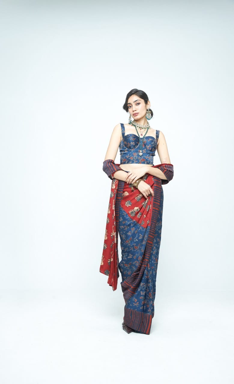 Elegant Eden saree by Anushe Pirani featuring intricate embroidery and vibrant fabric, displayed draped on a mannequin.