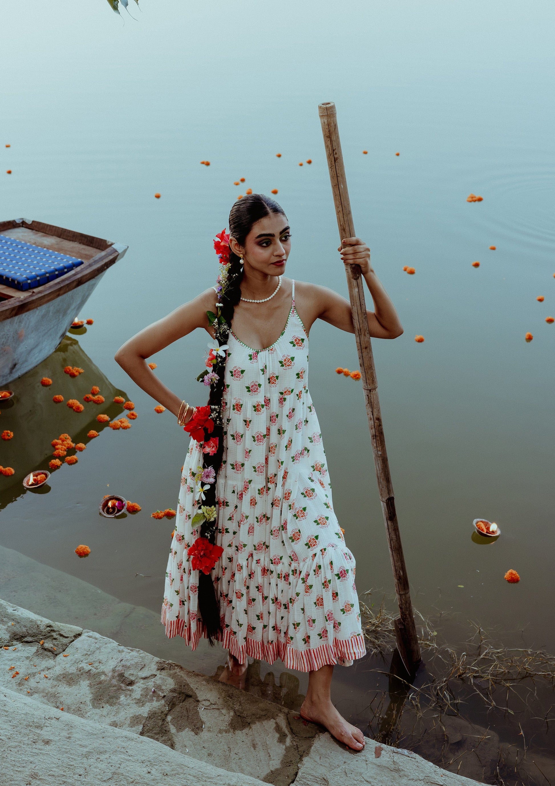 Marigold Begum Dress by The Raw India featuring intricate embroidery and flowing fabric, perfect for elegant occasions.