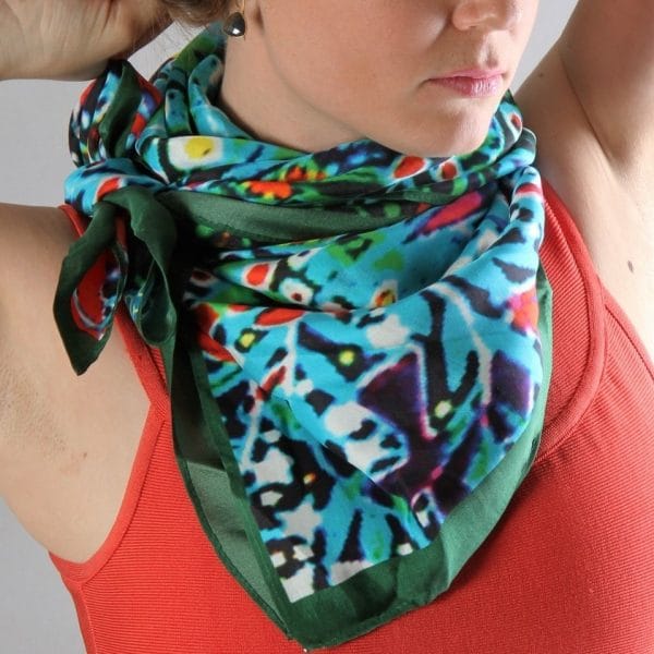 BlackJungleFever scarf by Bombaybirds featuring a bold jungle-inspired pattern in black and vibrant colors on soft fabric.