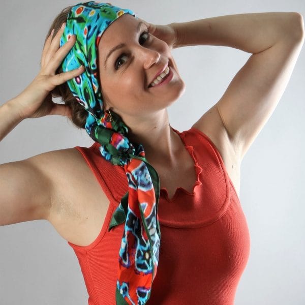 Blackjunglefever! scarf by Bombaybirds, featuring a vibrant jungle-inspired pattern, draped to showcase its lightweight fabric and stylish design.
