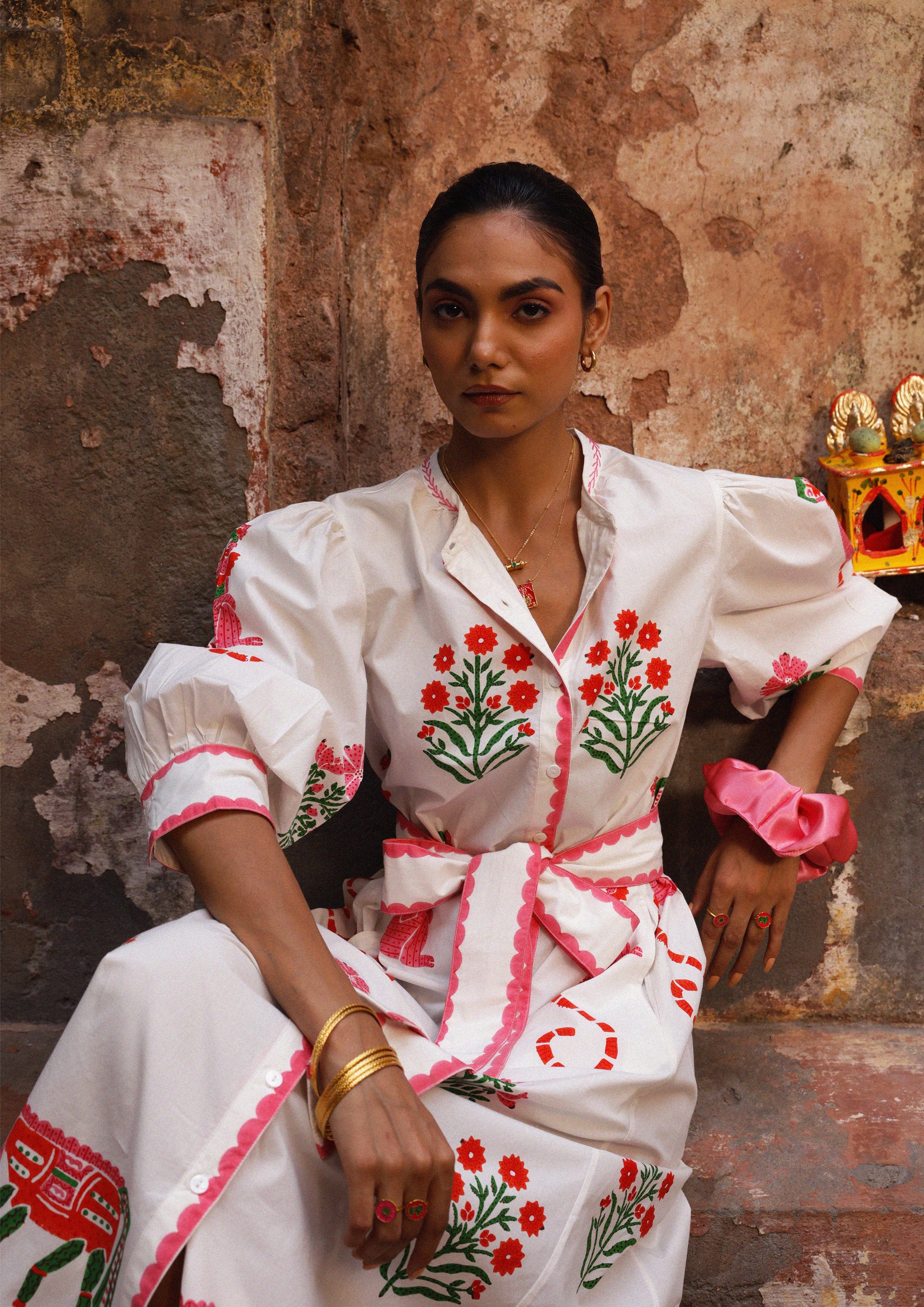 The Raw India Chaupad shirt dress with a mix print, featuring a relaxed fit and stylish design, displayed on a hanger.