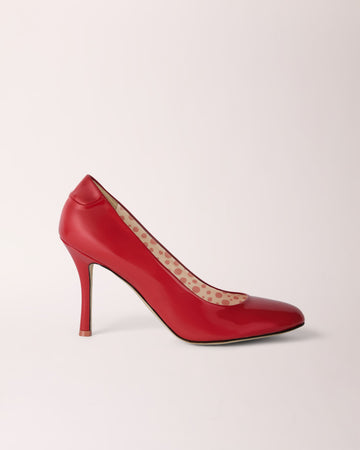 Red patent Classic Cheeletto Pump by Cheetah Stories, showcasing a stylish, glossy heel with elegant design.
