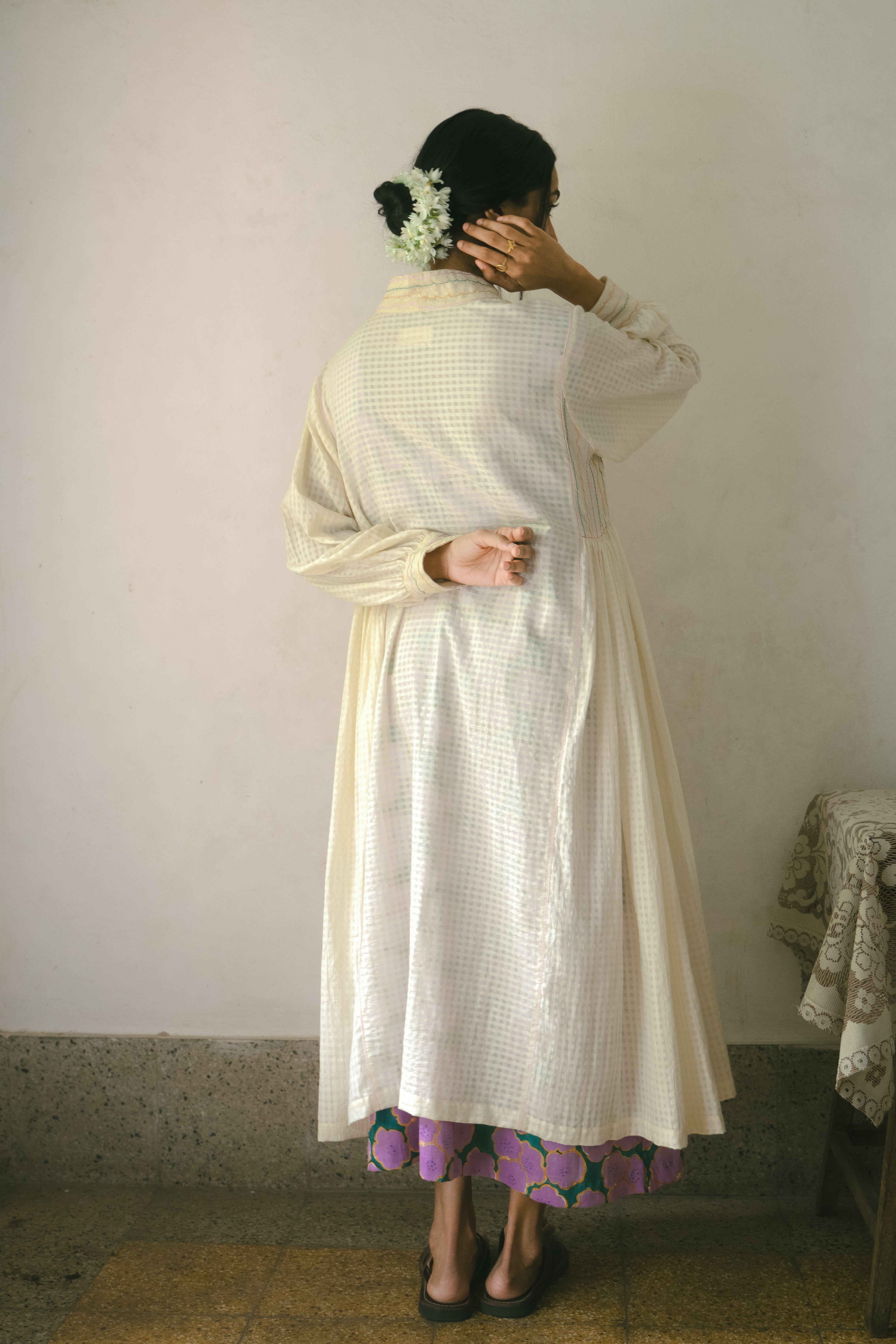 Deeta Noor dress featuring a stylish, elegant design with flowing fabric and intricate detailing, perfect for special occasions.