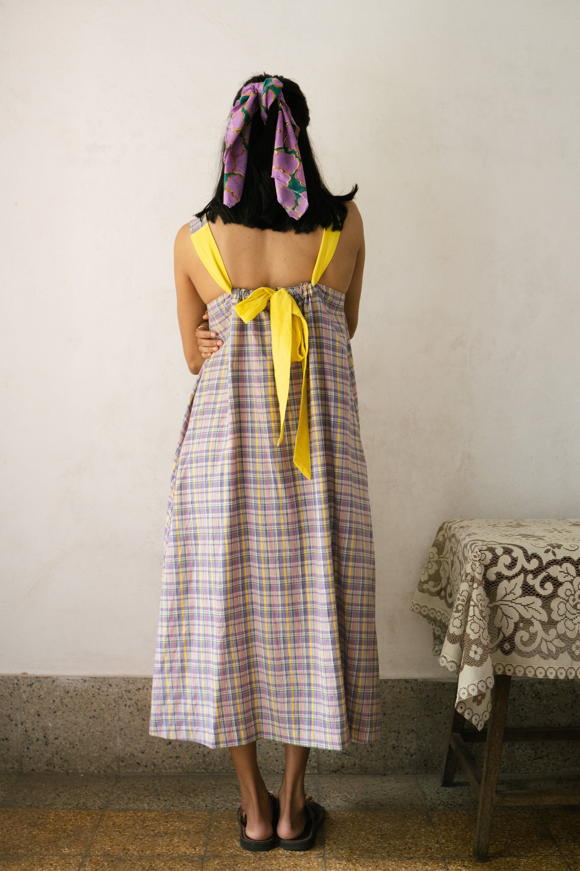 Deeta Meadow dress displayed on a hanger, featuring lightweight fabric and floral pattern perfect for casual spring wear.