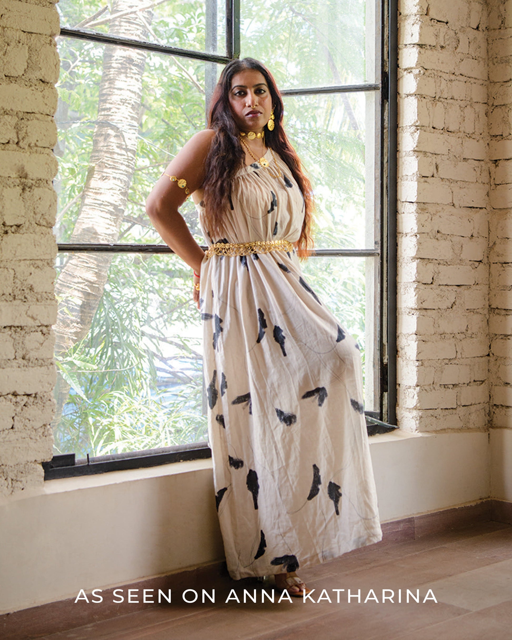 Doodlage Daryl printed dress with colorful floral pattern, short sleeves, and knee-length design on a hanger.