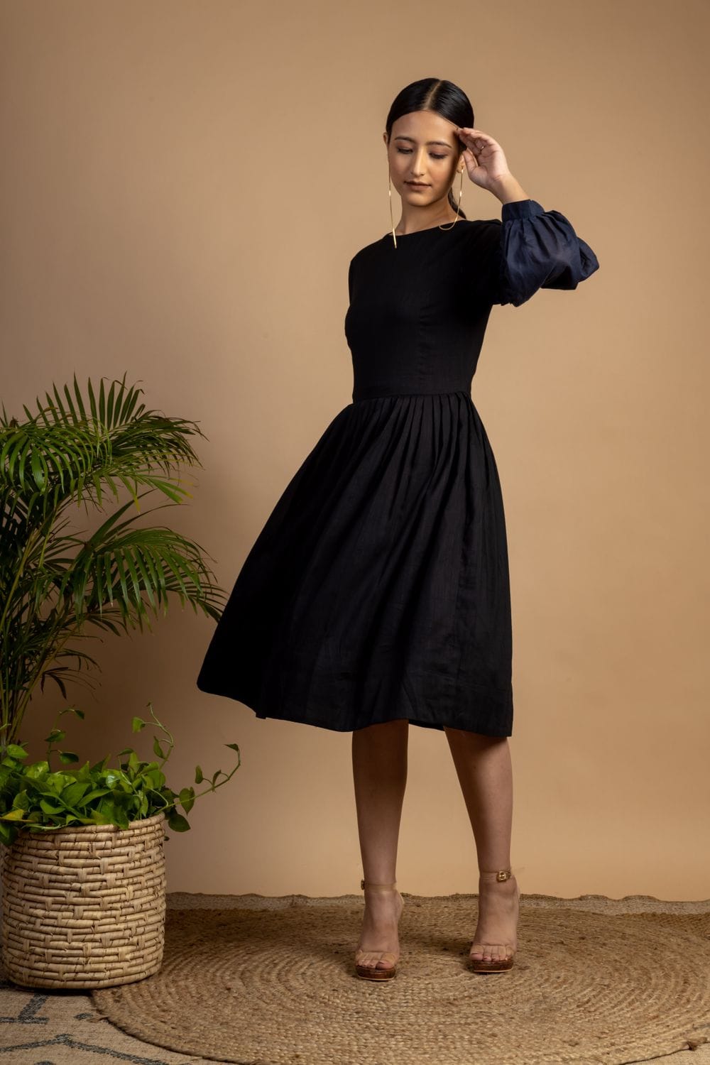 Sophia black dress by Doodlage featuring a stylish, fitted design with long sleeves and a knee-length hem.