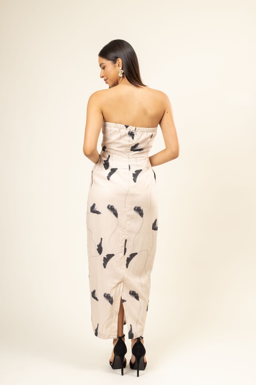 Doodlage Denise printed dress with colorful floral pattern, short sleeves, and knee-length fit on a hanger.