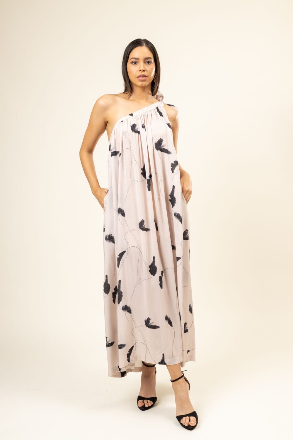 Doodlage Daryl printed dress with colorful patterns, knee-length design, and long sleeves, displayed on a hanger.