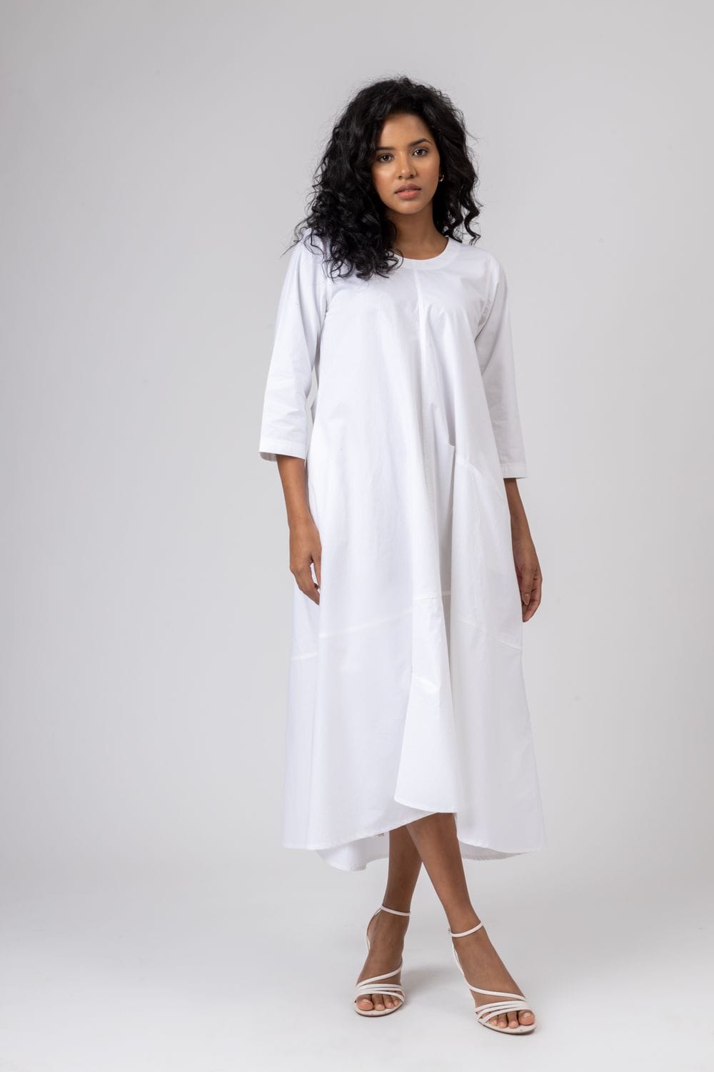 White Jill dress by Doodlage featuring a flowing design and lightweight fabric, perfect for casual or semi-formal occasions.