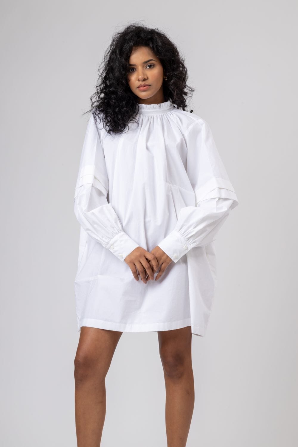White Alice dress by Doodlage featuring a flowy silhouette and subtle detailing, perfect for casual or semi-formal occasions.