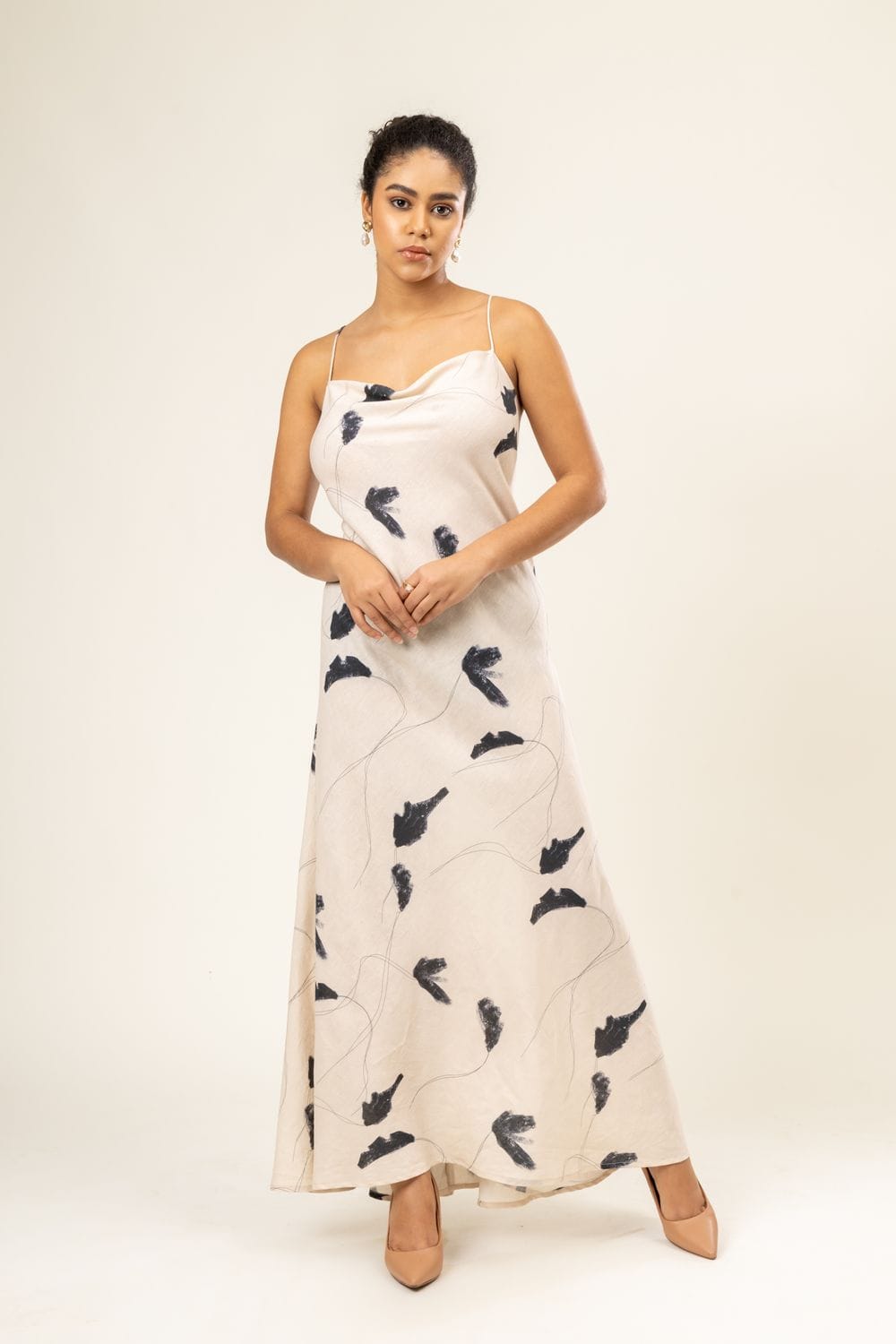 Doodlage Lola printed dress featuring vibrant floral patterns and lightweight fabric, displayed on a hanger.