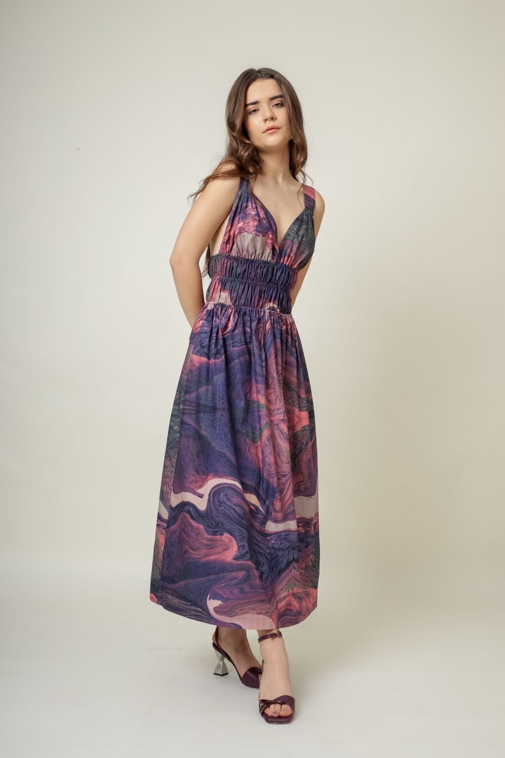 Doodlage August printed dress with colorful floral pattern, short sleeves, and knee-length design on a hanger.