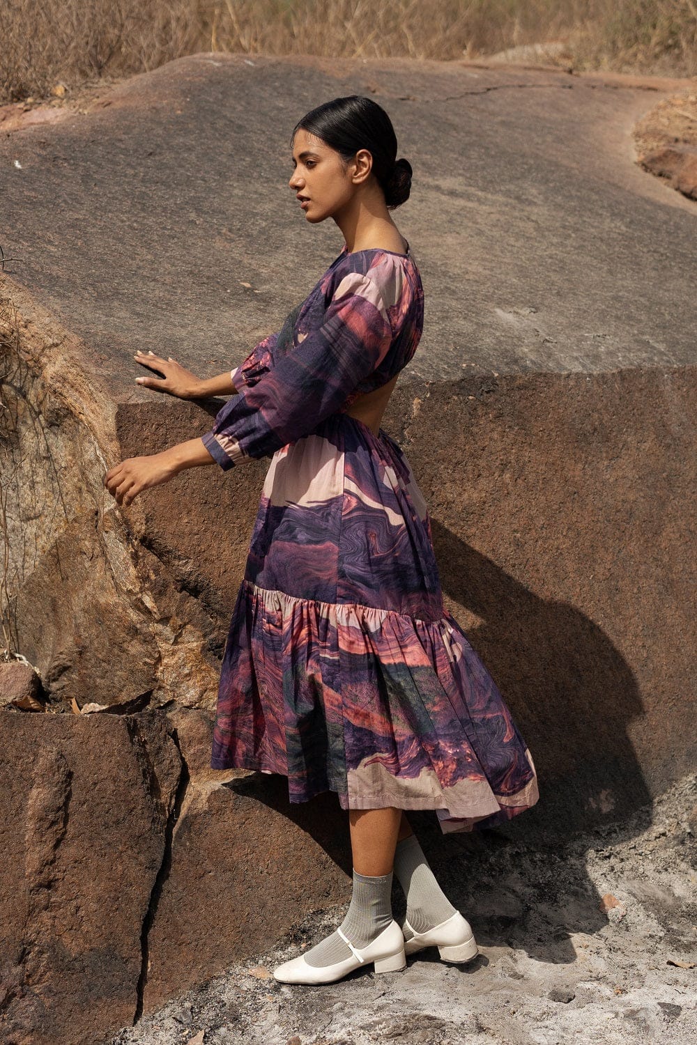 Amino printed Doodlage dress with colorful geometric patterns, long sleeves, and a relaxed fit, displayed on a hanger.