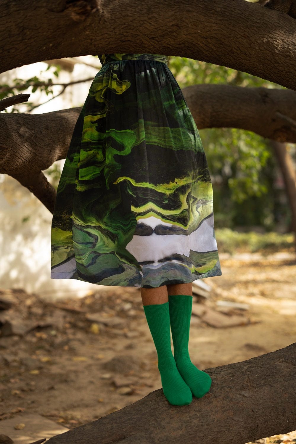 Ella green Doodlage dress featuring a flowy fabric, round neckline, and short sleeves, perfect for casual or semi-formal wear.