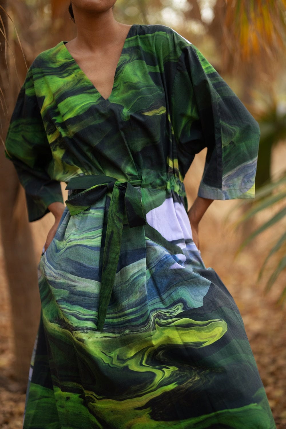 Doodlage Doris green dress with flowy fabric and short sleeves, stylish casual wear for women.