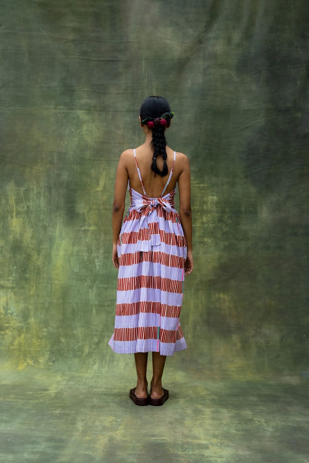 Doodlage Mary striped dress with long sleeves and midi length, featuring colorful horizontal stripes on soft fabric.