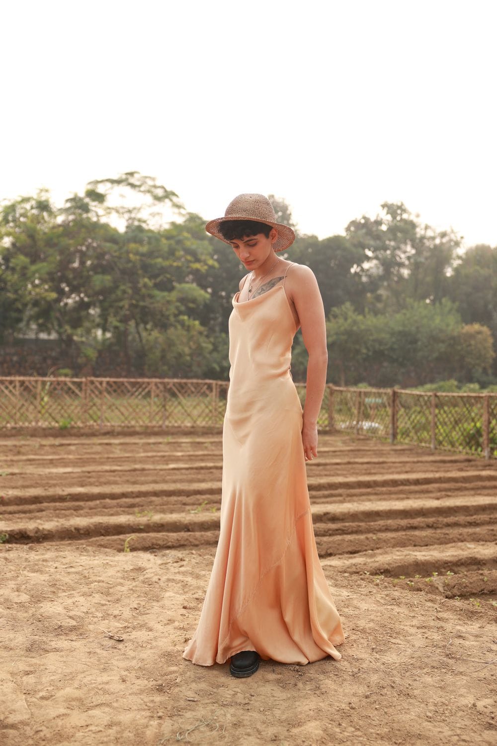 Doodlage Lola beige dress displayed on a hanger, showcasing its casual style and lightweight fabric.