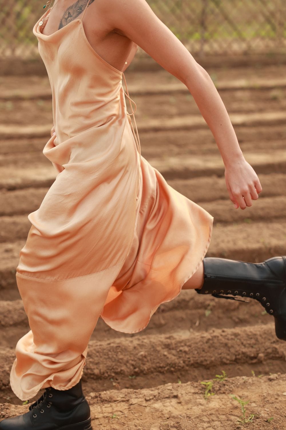 Doodlage Lola beige dress with a flowy silhouette, short sleeves, and subtle details, perfect for casual or semi-formal wear.