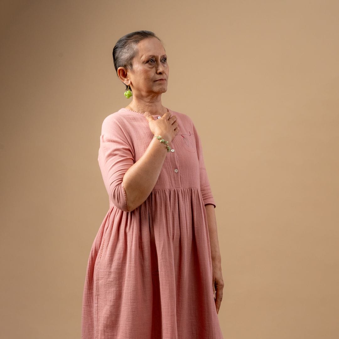 Doodlage Kara rose dress, stylish floral dress with feminine design, displayed on a hanger against a plain background.