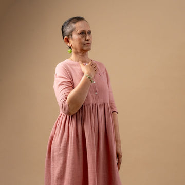 Doodlage Kara rose dress, stylish floral dress with feminine design, displayed on a hanger against a plain background.