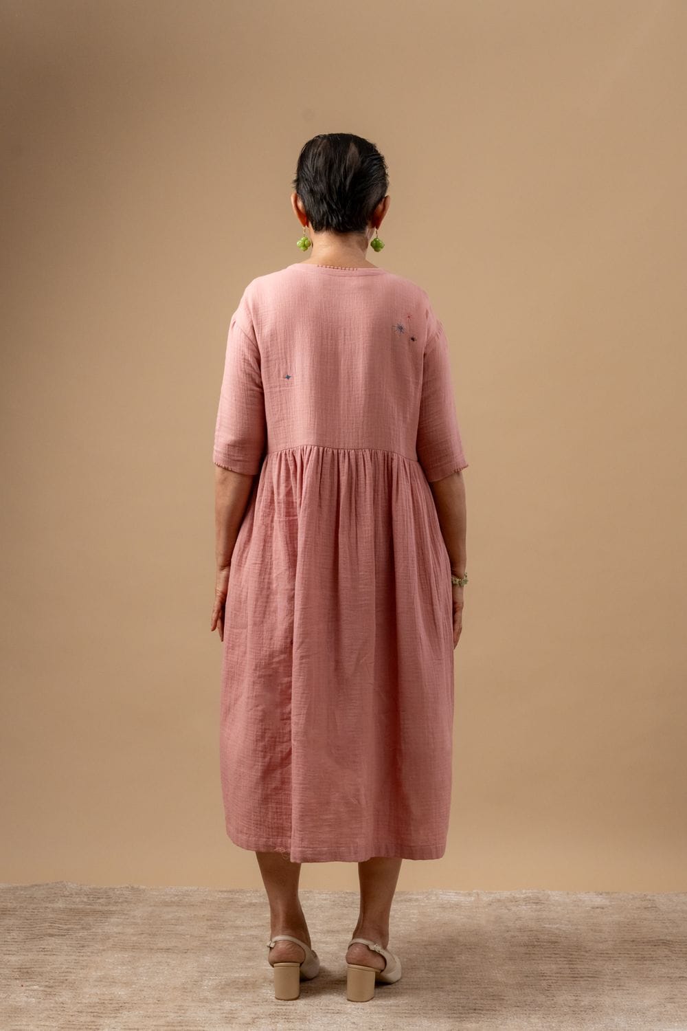 Doodlage Kara rose dress featuring floral print, lightweight fabric, and relaxed fit, displayed on a model showcasing its design.