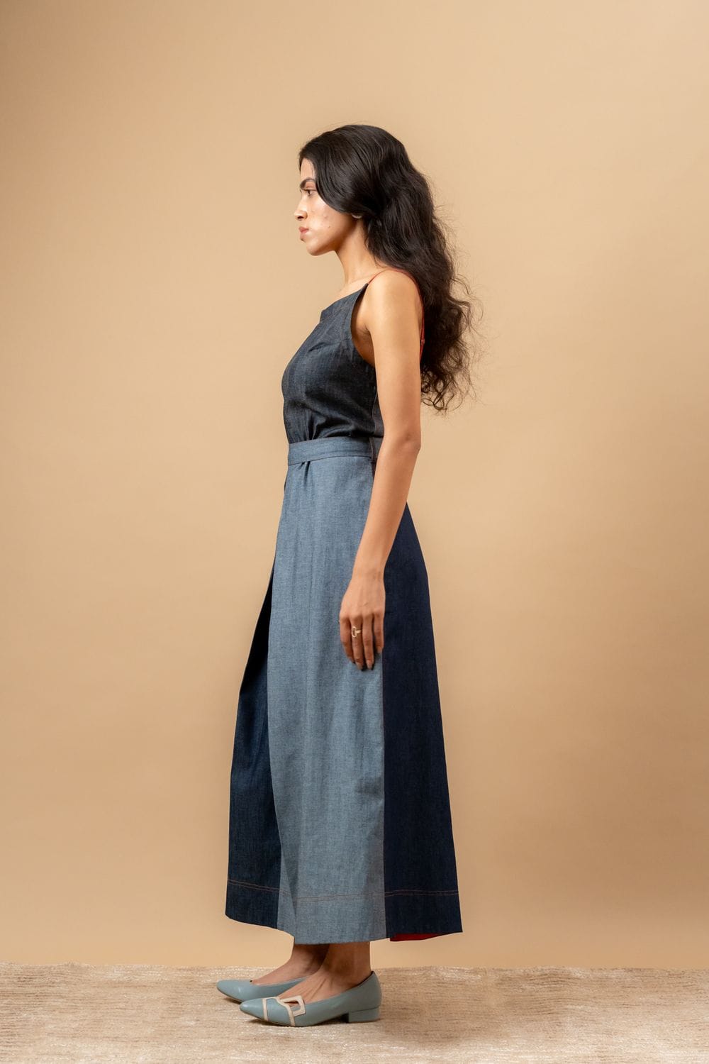 Doodlage Louisa upcycled denim dress showing a casual fit with patchwork details and short sleeves on a hanger.