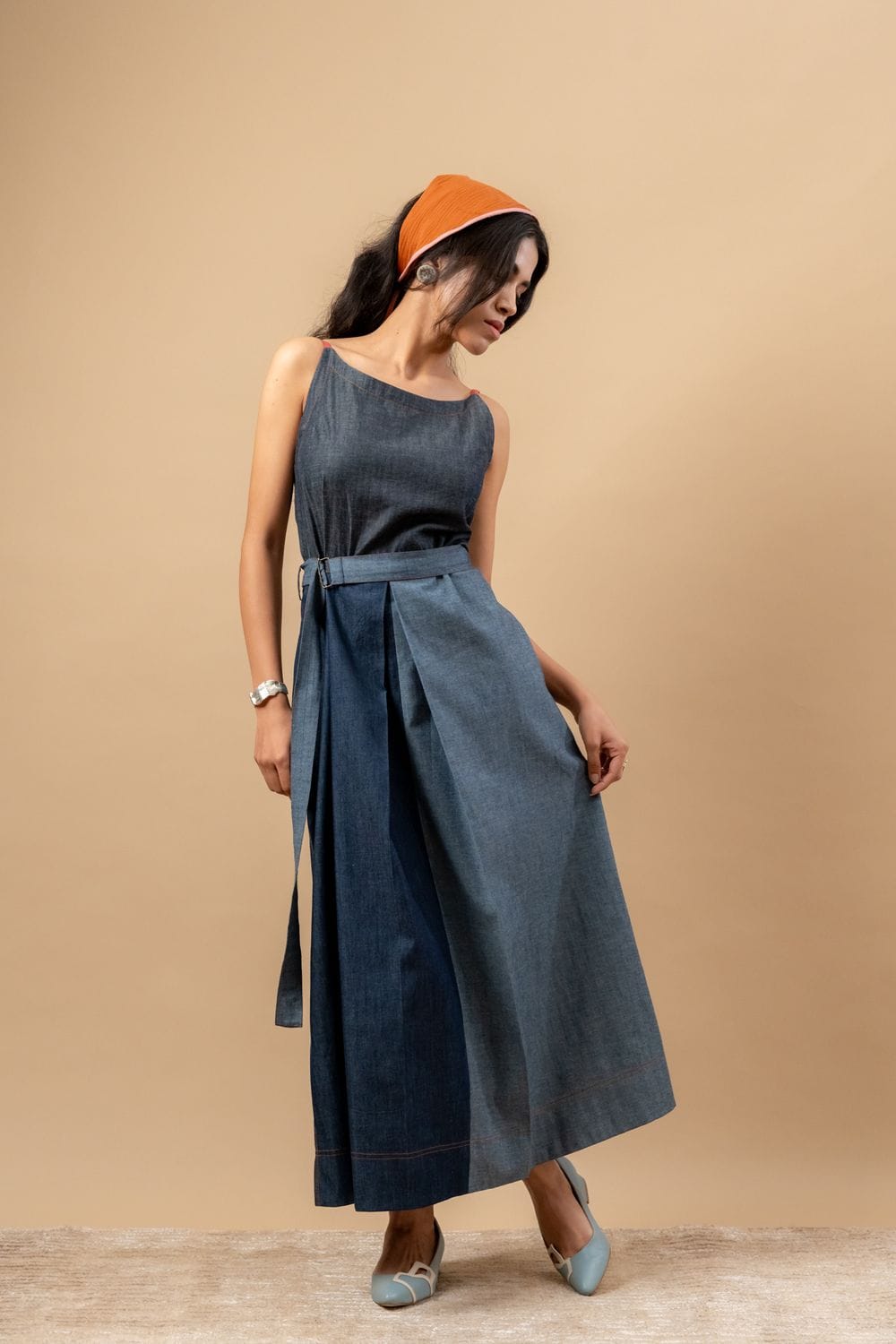 Louisa upcycled denim dress by Doodlage featuring a fitted silhouette and classic denim texture, shown on a hanger.