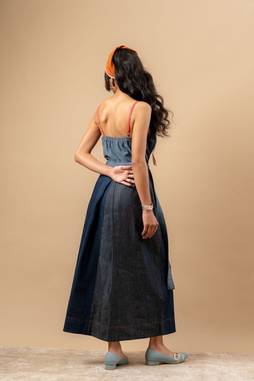 Doodlage Louisa upcycled denim dress with long sleeves and a fitted waist, styled with casual accessories.