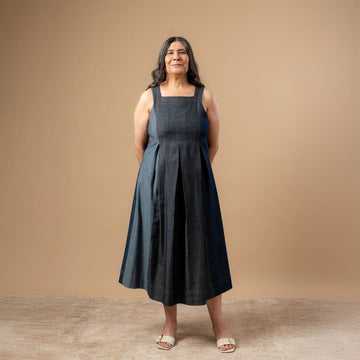 Doodlage Natalie denim dress displayed on a hanger, showcasing its casual style and classic denim fabric.