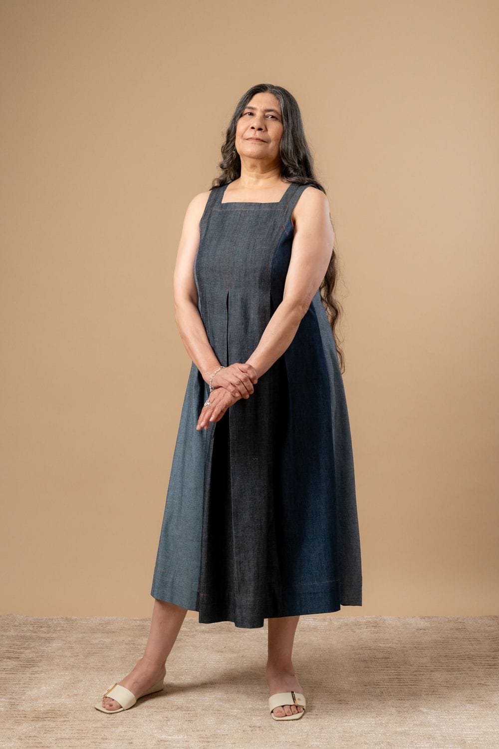 Doodlage Natalie denim dress shown on a model, featuring a casual fit, knee-length design, and classic denim fabric.