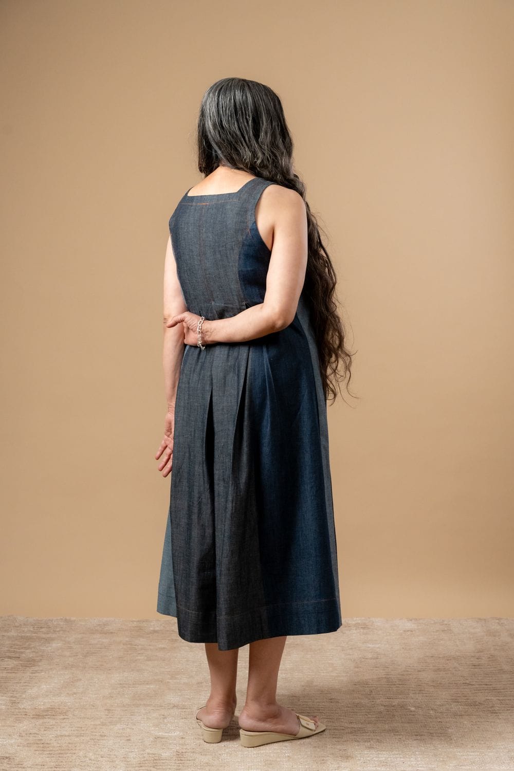 Doodlage Natalie denim dress with a fitted bodice and flowing skirt, featuring classic denim texture and stylish design.