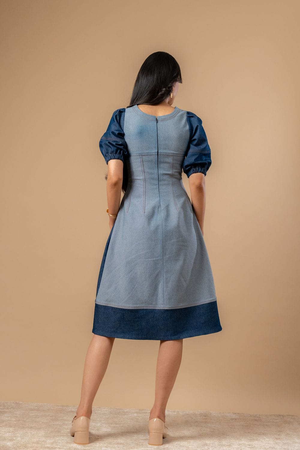 Doodlage Isabelle upcycled denim dress featuring a casual fit, sleeveless design, and patchwork details, laid flat on a white background.