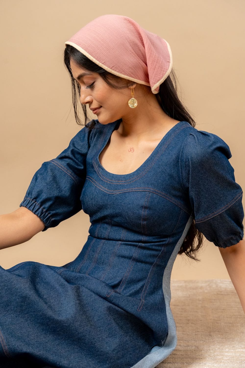 Isabelle upcycled denim dress by Doodlage, featuring a casual fit with patchwork denim and button details on a model.