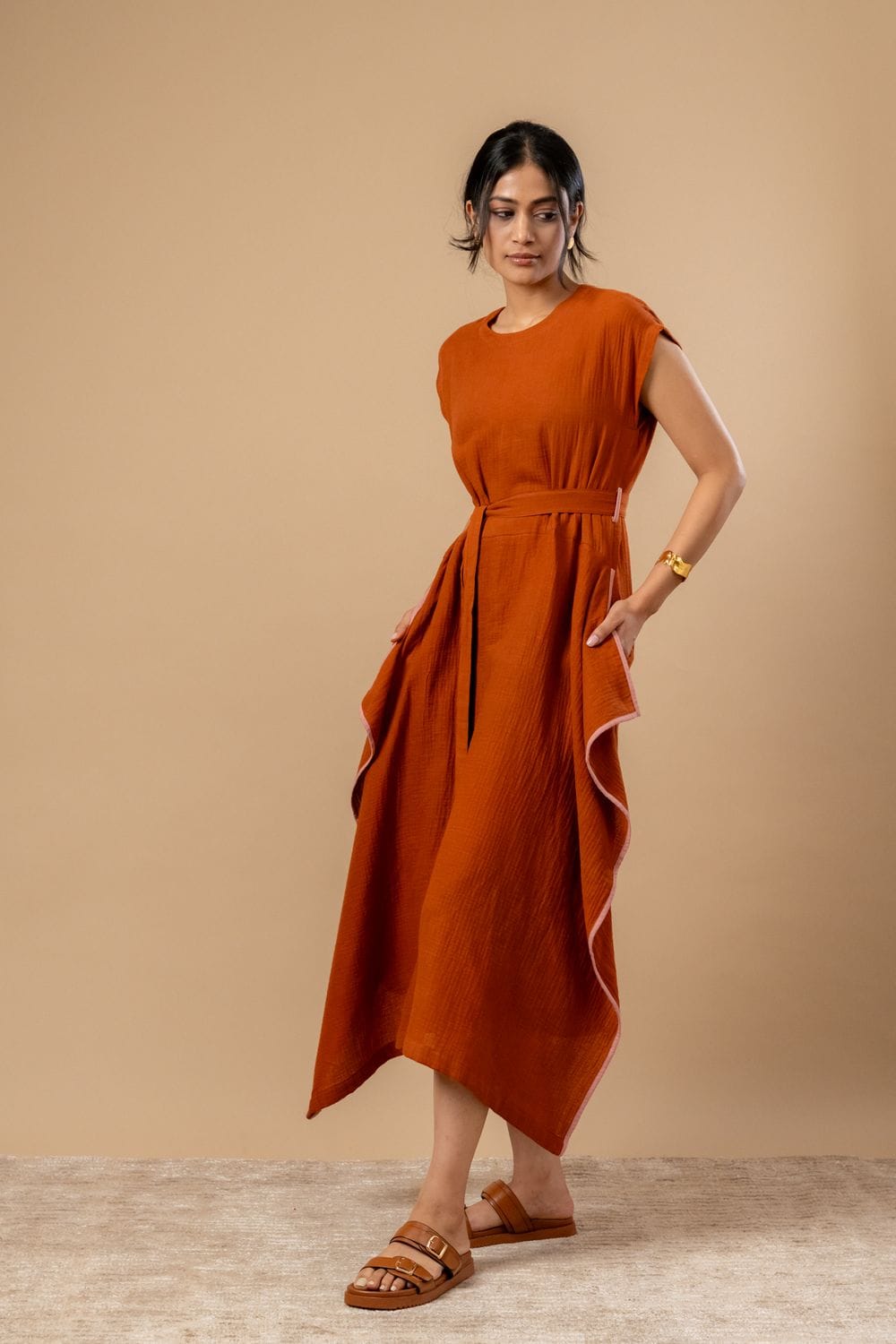 Doodlage Bessie knot dress in earthy tones, featuring a relaxed fit with knot details at the waist and a flowy silhouette.